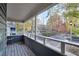 Private porch with wooden floors provides a peaceful view of the surrounding greenery and street at 1482 N Crossing Ne Cir, Atlanta, GA 30329