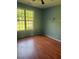 Cozy bedroom with hardwood floors and large windows, providing ample natural light at 21 Spring Folly Nw, Cartersville, GA 30121