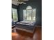 Bedroom featuring hardwood floors, ample natural light from large windows, and neutral wall color at 21 Spring Folly Nw, Cartersville, GA 30121