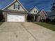 Charming one-story home with a two-car garage, brick accents, and a well-maintained lawn at 21 Spring Folly Nw, Cartersville, GA 30121
