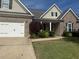 Charming one-story home with brick accents, lush landscaping, and a well-manicured lawn at 21 Spring Folly Nw, Cartersville, GA 30121