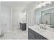 This bathroom features double sinks, a soaking tub, marble floors, and stunning fixtures at 3111 Stonegate Sw Dr, Atlanta, GA 30331