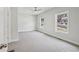 Spacious bedroom with neutral carpet, ceiling fan and natural light from large windows at 3111 Stonegate Sw Dr, Atlanta, GA 30331