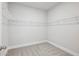 Walk-in closet with carpet flooring and white shelving for optimal storage solutions at 3111 Stonegate Sw Dr, Atlanta, GA 30331