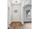 Bright entryway with hardwood floors, white door with glass, and view to the outdoors at 3111 Stonegate Sw Dr, Atlanta, GA 30331
