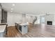 Open-concept kitchen with island and stainless steel appliances flows into a spacious living area at 3111 Stonegate Sw Dr, Atlanta, GA 30331