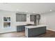 Modern kitchen with gray cabinets, white countertops, and stainless steel appliances at 3111 Stonegate Sw Dr, Atlanta, GA 30331