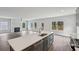 Gourmet kitchen island offers seating and ample counter space, with views to the living area at 3111 Stonegate Sw Dr, Atlanta, GA 30331