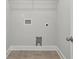 The laundry room includes tile flooring, washer/dryer hookups, and a wire shelf at 3111 Stonegate Sw Dr, Atlanta, GA 30331