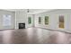 Bright and airy living room with fireplace and large windows showcasing the outdoor view at 3111 Stonegate Sw Dr, Atlanta, GA 30331
