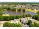 Overhead view of community amenities including a swimming pool, lake, and clubhouse at 40 Wimberly Way, Covington, GA 30016