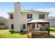Home's exterior featuring a large patio area with a gazebo and a well-kept lawn at 40 Wimberly Way, Covington, GA 30016
