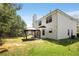 White siding home with lush green backyard, patio, and gazebo at 40 Wimberly Way, Covington, GA 30016