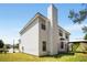 Two-story home featuring white siding, a chimney, and a well-maintained lawn at 40 Wimberly Way, Covington, GA 30016