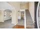 Inviting foyer with hardwood floors, staircase, and arched doorways at 40 Wimberly Way, Covington, GA 30016