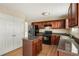 Functional kitchen with wood cabinets, island, and modern appliances at 40 Wimberly Way, Covington, GA 30016