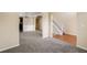 Spacious living room with neutral carpet, crown molding, and stairway at 40 Wimberly Way, Covington, GA 30016