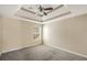 Spacious bedroom with tray ceiling, ceiling fan, and ample natural light from the window at 40 Wimberly Way, Covington, GA 30016