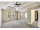 Expansive main bedroom with tray ceilings, windows, and neutral tones, ready for personalization at 40 Wimberly Way, Covington, GA 30016