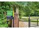 Armand Greenspace sign and view of lawn with benches at 962 Cardova Ne Dr, Atlanta, GA 30324