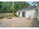 Spacious backyard with a stone fire pit and a brick patio with bocce ball set at 962 Cardova Ne Dr, Atlanta, GA 30324