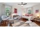 Bright bedroom showcasing natural light, hardwood floors, neutral tones, and a cozy daybed at 962 Cardova Ne Dr, Atlanta, GA 30324