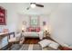 Bright bedroom with natural light, hardwood floors, neutral tones, and a cozy daybed at 962 Cardova Ne Dr, Atlanta, GA 30324