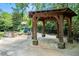 Charming gazebo with stone pillars, view of playground, and green landscaping in the park at 962 Cardova Ne Dr, Atlanta, GA 30324