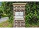 Elegant brick pillar sign for Lindridge Martin Manor community surrounded by greenery at 962 Cardova Ne Dr, Atlanta, GA 30324