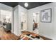 Hallway with hardwood floors leading to different rooms, including kitchen and bathroom at 962 Cardova Ne Dr, Atlanta, GA 30324