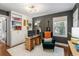 Charming home office with custom built-ins, neutral colors, modern lighting, and an eye-catching accent chair at 962 Cardova Ne Dr, Atlanta, GA 30324