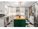 Modern kitchen with stainless steel appliances, a butcher block island and black and white checkered flooring at 962 Cardova Ne Dr, Atlanta, GA 30324