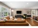 Inviting living room with large windows, comfortable leather sofa, and modern decor at 962 Cardova Ne Dr, Atlanta, GA 30324