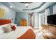 Comfortable main bedroom with natural light from the windows, hardwood flooring, and stylish furnishings at 962 Cardova Ne Dr, Atlanta, GA 30324
