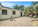 Large brick patio with seating and a manicured garden bed, perfect for outdoor gatherings at 962 Cardova Ne Dr, Atlanta, GA 30324
