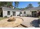 Backyard patio features a stone firepit, outdoor seating, and a well-manicured outdoor space at 962 Cardova Ne Dr, Atlanta, GA 30324