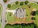 Aerial view showing a beautifully landscaped property with lush greenery and mature trees surrounding a well-maintained home at 161 Archstone Sq, Mcdonough, GA 30253
