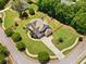 An expansive lot with mature trees and a well-maintained lawn surrounds this beautiful two-story home at 161 Archstone Sq, Mcdonough, GA 30253