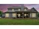 An inviting covered patio highlights the home's backyard, perfect for outdoor gatherings and relaxation at 161 Archstone Sq, Mcdonough, GA 30253