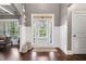 Bright foyer with hardwood floors, white wainscoting, and a front door with sidelights at 161 Archstone Sq, Mcdonough, GA 30253