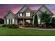 Charming home exterior with stone accents, manicured landscaping, and a welcoming front porch at 161 Archstone Sq, Mcdonough, GA 30253