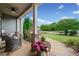 Inviting front porch featuring stone accents and comfortable seating, offering a relaxing outdoor space at 161 Archstone Sq, Mcdonough, GA 30253