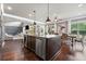 Gourmet kitchen with granite countertops, stainless steel appliances, and a large island at 161 Archstone Sq, Mcdonough, GA 30253