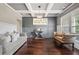 Elegant living room featuring coffered ceilings, hardwood floors, and stylish decor at 161 Archstone Sq, Mcdonough, GA 30253