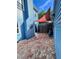 Cozy backyard patio features brick paving and a shade sail, complemented by the home's blue exterior at 260 Manning Sw Rd # 42, Marietta, GA 30064