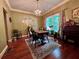 Charming dining room with decorative plates on the wall, hardwood flooring and vintage chandelier at 260 Manning Sw Rd # 42, Marietta, GA 30064