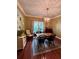 Elegant dining room showcasing a wooden table, chandelier, hardwood floors and natural light at 260 Manning Sw Rd # 42, Marietta, GA 30064