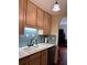 Galley kitchen showcases modern appliances, under cabinet lighting, and white countertops at 260 Manning Sw Rd # 42, Marietta, GA 30064