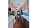 Galley kitchen with a blue tiled backsplash, updated appliances, and hardwood flooring at 260 Manning Sw Rd # 42, Marietta, GA 30064