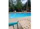 Community swimming pool with lounge chairs, umbrellas, and a relaxing atmosphere at 260 Manning Sw Rd # 42, Marietta, GA 30064